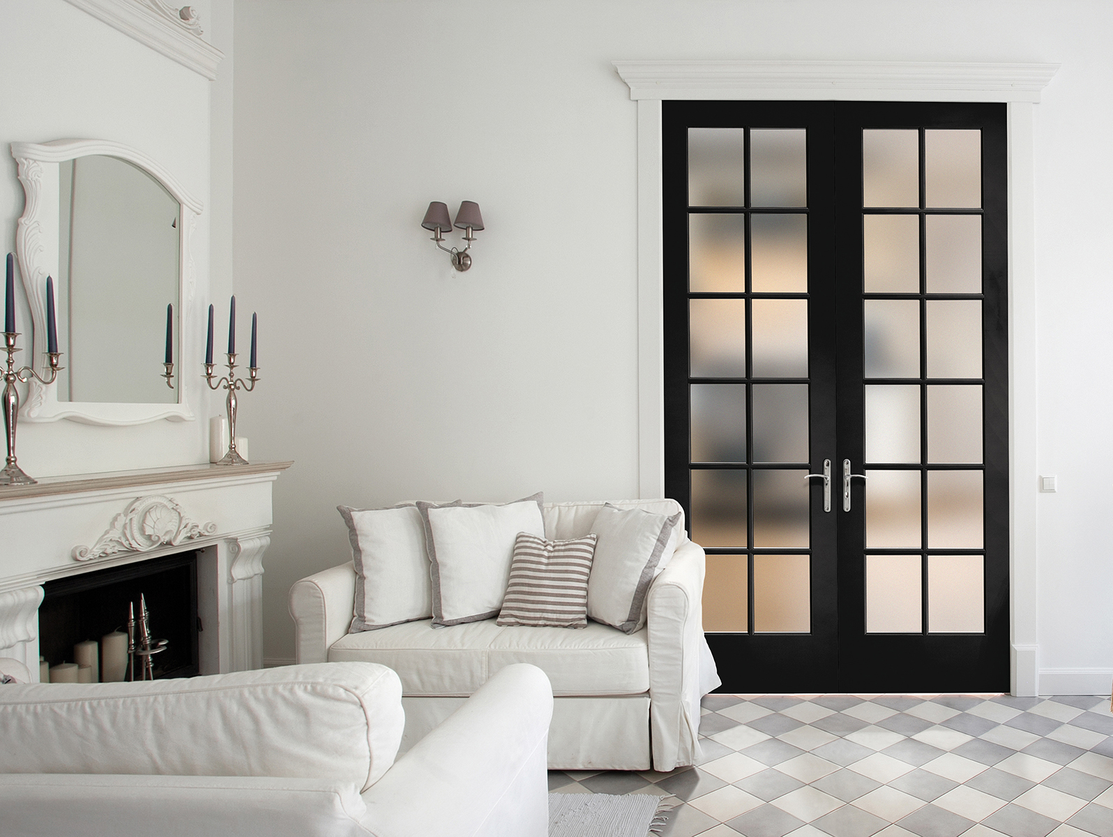 The interior of a modern sitting room with tile floors, a white fireplace and double French black doors with 12 equal lite glass panels in each
